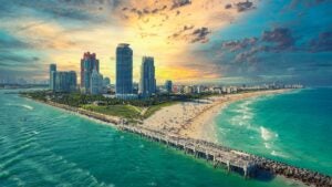south beach during sunset with view of buildings, shore, water in Miami, Florida, USA